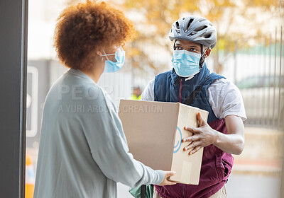 Buy stock photo Black man, mask and delivery with box for woman at house for logistics, cargo and safety from covid 19. Young african courier, package and shipping service with stock, helmet and e commerce in city