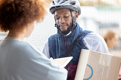 Buy stock photo Black man, box and delivery for female customer service, package or signing on tablet for order in city. African American male courier employee delivering cargo to woman with touchscreen in ecommerce