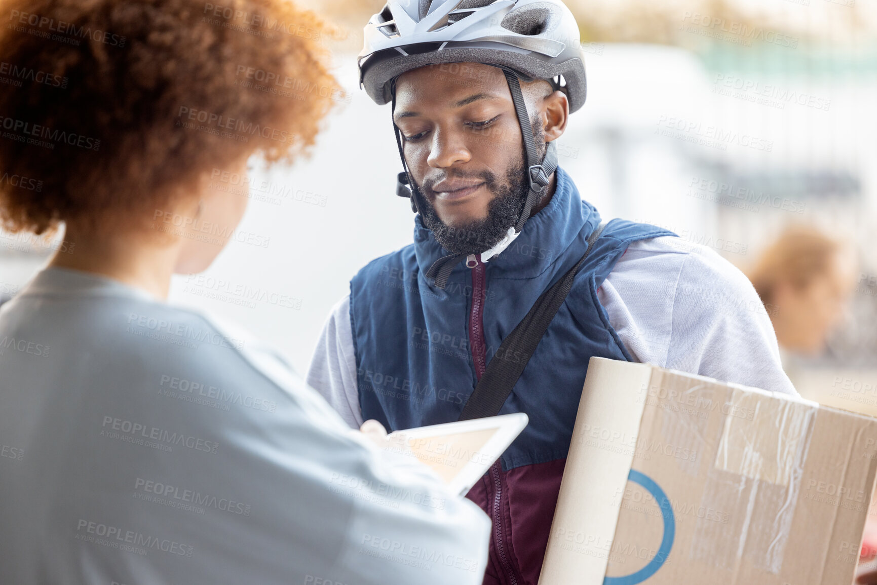 Buy stock photo Black man, box and delivery for female customer service, package or signing on tablet for order in city. African American male courier employee delivering cargo to woman with touchscreen in ecommerce