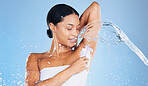 Beauty model, water splash or shaving underarms on blue background in relax grooming, body hair removal or healthcare wellness. Black woman, happy or wet with razor foam for armpit skincare cleaning