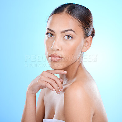 Buy stock photo Portrait, skincare and blue background with a model black woman in studio for beauty or wellness. Face, skin and makeup with an attractive young female posing for natural treatment or cosmetics