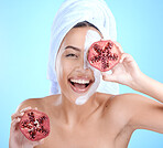 Skincare, pomegranate and face mask portrait of woman happy about natural dermatology cosmetics. Excited person with sustainable spa beauty product for self care, skin glow and facial blue background