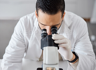 Buy stock photo Science, microscope and a doctor man at work in a laboratory for innovation or research. Medical, analytics and biotechnology with a male scientist working in a lab for breakthrough