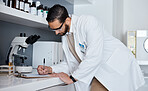 Science, writing and man in laboratory for research, medical report and analytics on clipboard. Pharmaceutical medicine, healthcare and scientist write notes for data analysis, test results and study