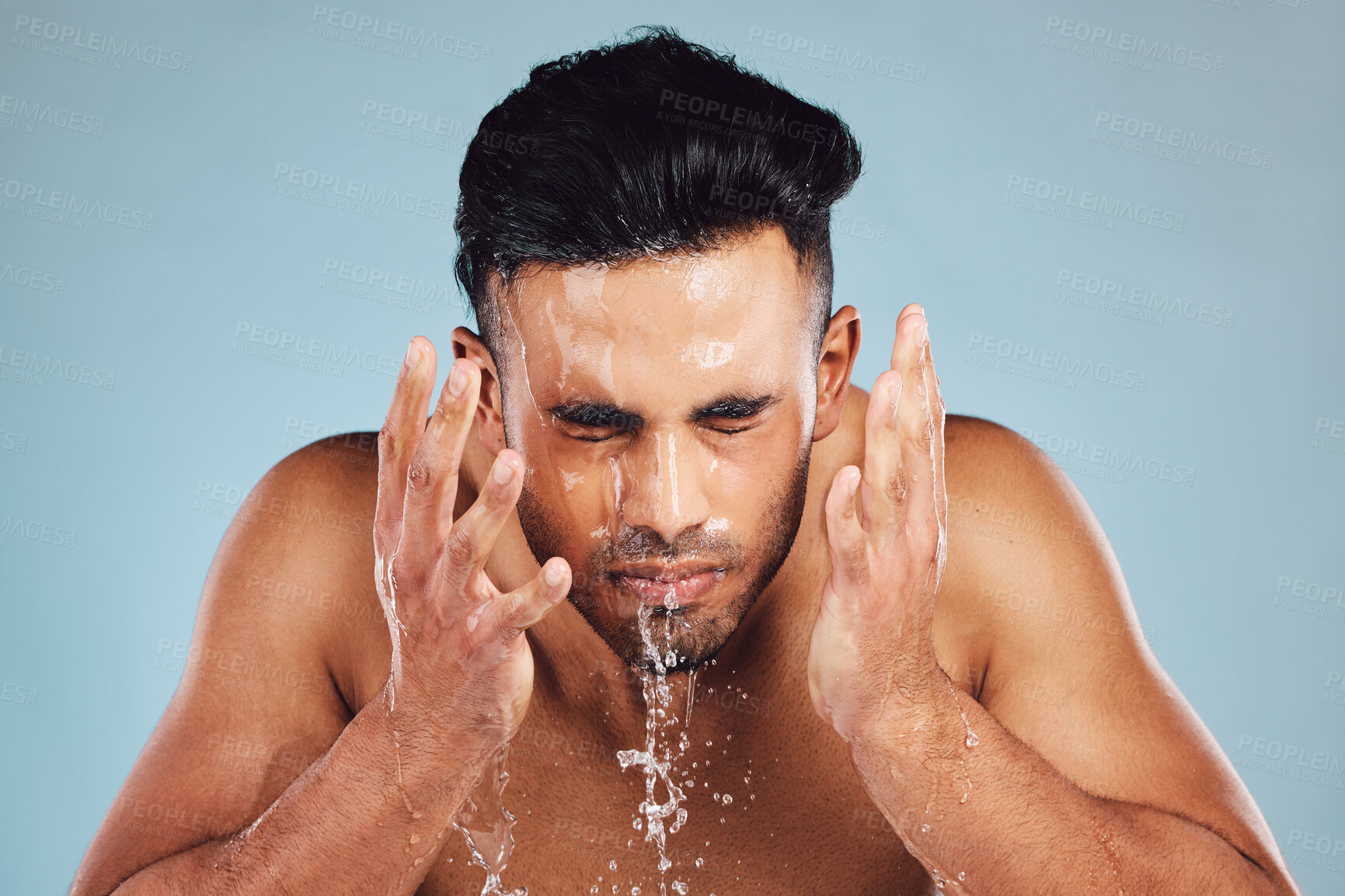 Buy stock photo Man, water and hands in face wash for skincare, fresh clean hygiene or grooming against studio background. Young male model in beauty, wellness and washing, cleaning or cleansing for facial treatment