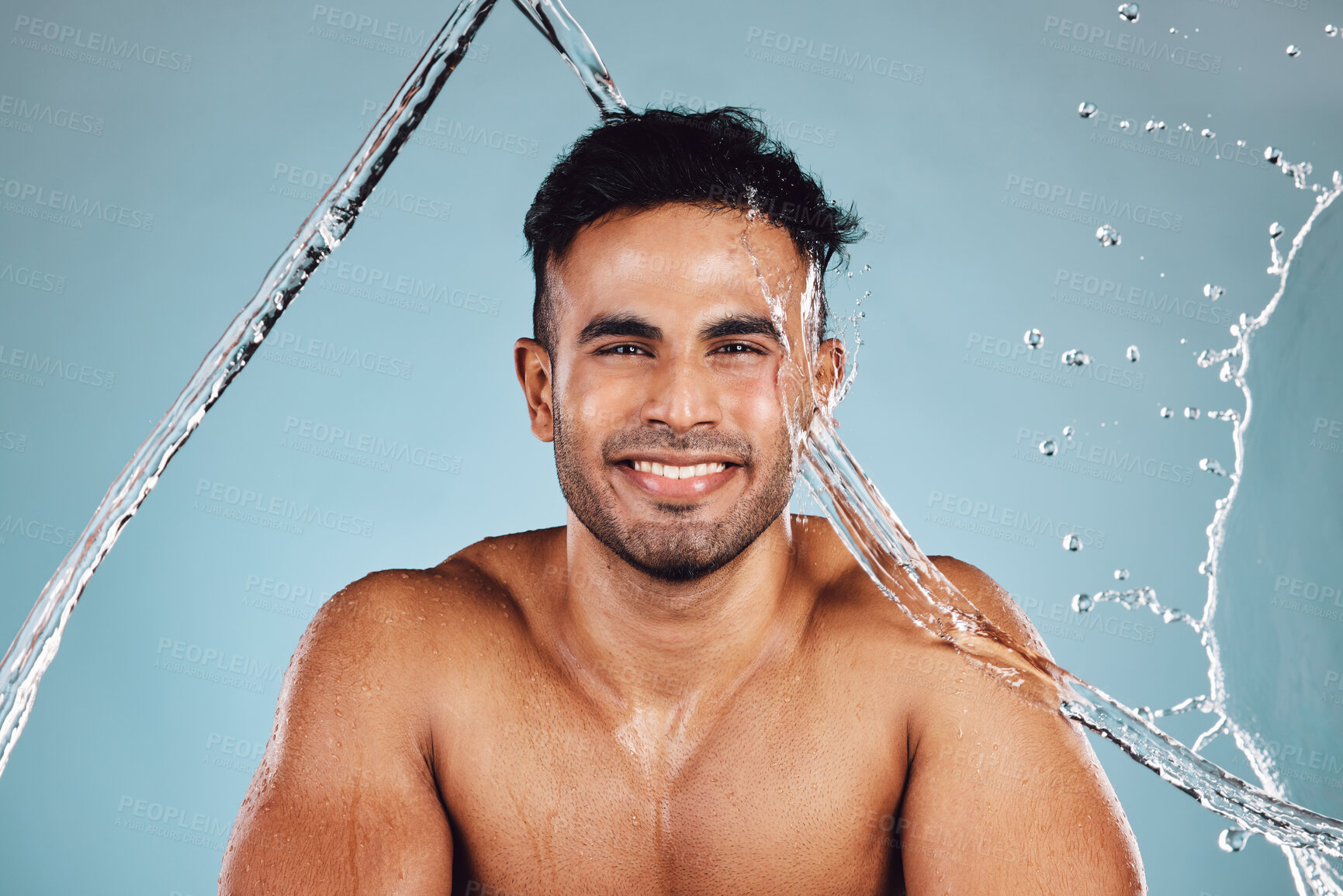 Buy stock photo Water splash, portrait and skincare man isolated on blue background face cleaning, body shower and beauty. Fitness model or person in studio headshot for aesthetic, washing and dermatology hygiene