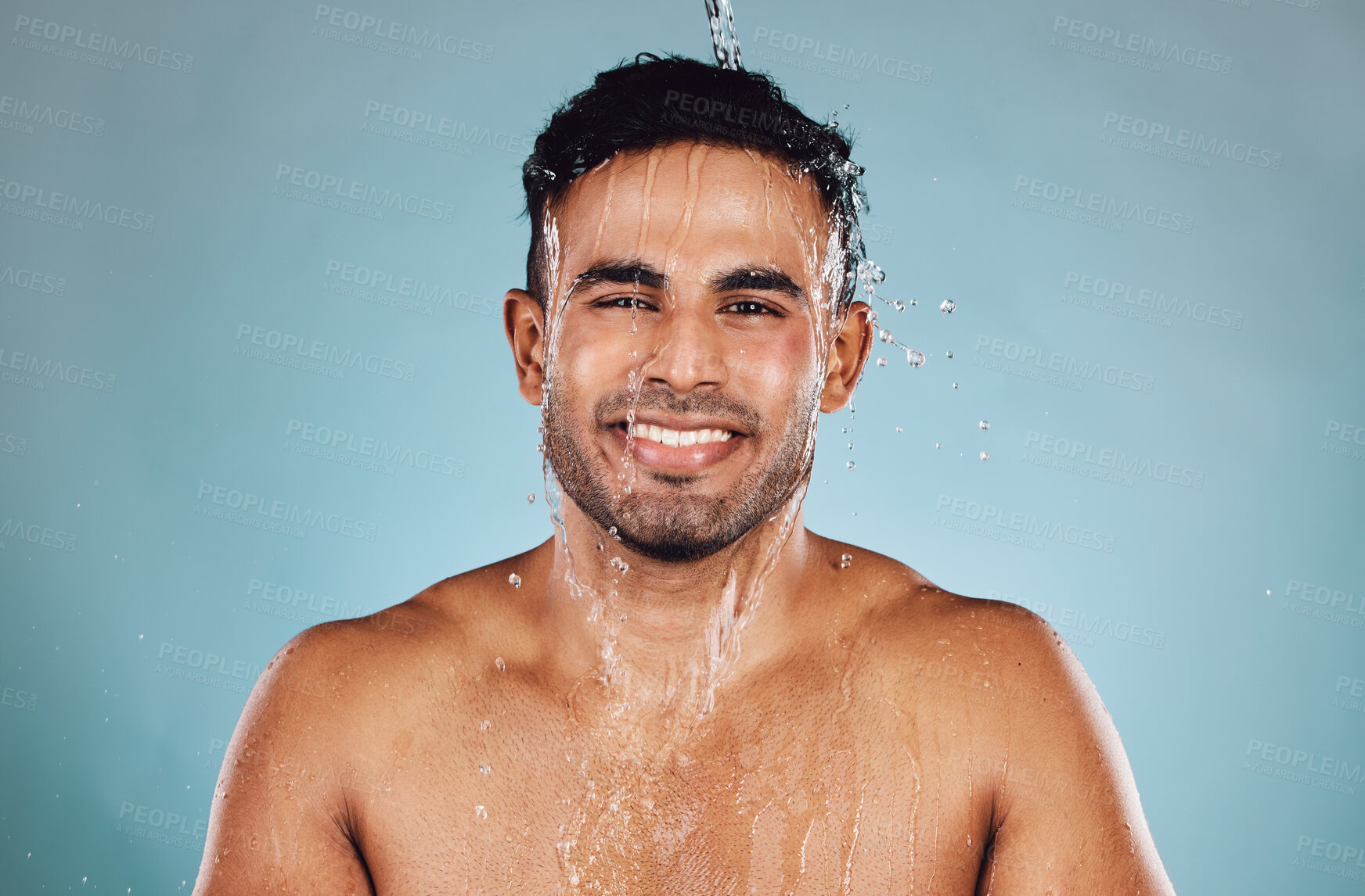 Buy stock photo Portrait, wet and man with water, cleaning and hygiene with guy on blue studio background. Face, male and gentleman with liquid, aqua or washing for skincare, morning routine or grooming on backdrop 