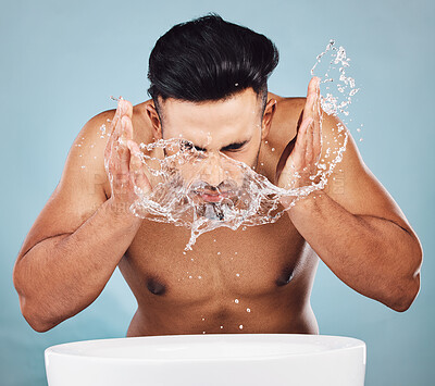 Buy stock photo Man, water splash and face wash by basin for skincare, fresh clean hygiene or grooming against a studio background. Young male model in beauty, wellness and washing or cleansing for facial treatment