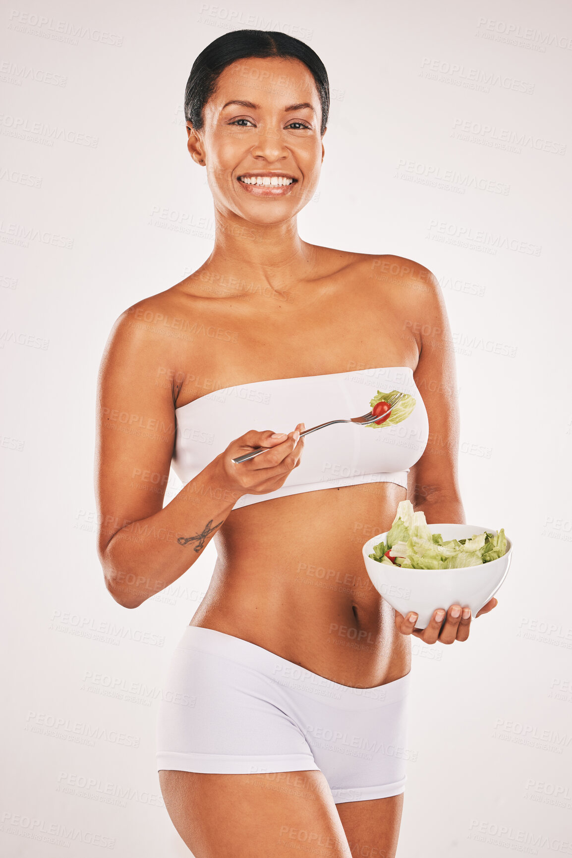 Buy stock photo Salad, portrait and body of woman isolated on a white background for diet, lose weight and healthy food promotion. Green vegetables, fitness and model person in underwear for detox results in studio