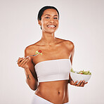 Health, portrait or woman with a salad in studio for a healthy meal, nutrition diet or digestion benefits. Body goals, lose weight or happy female model eating food isolated on a white background