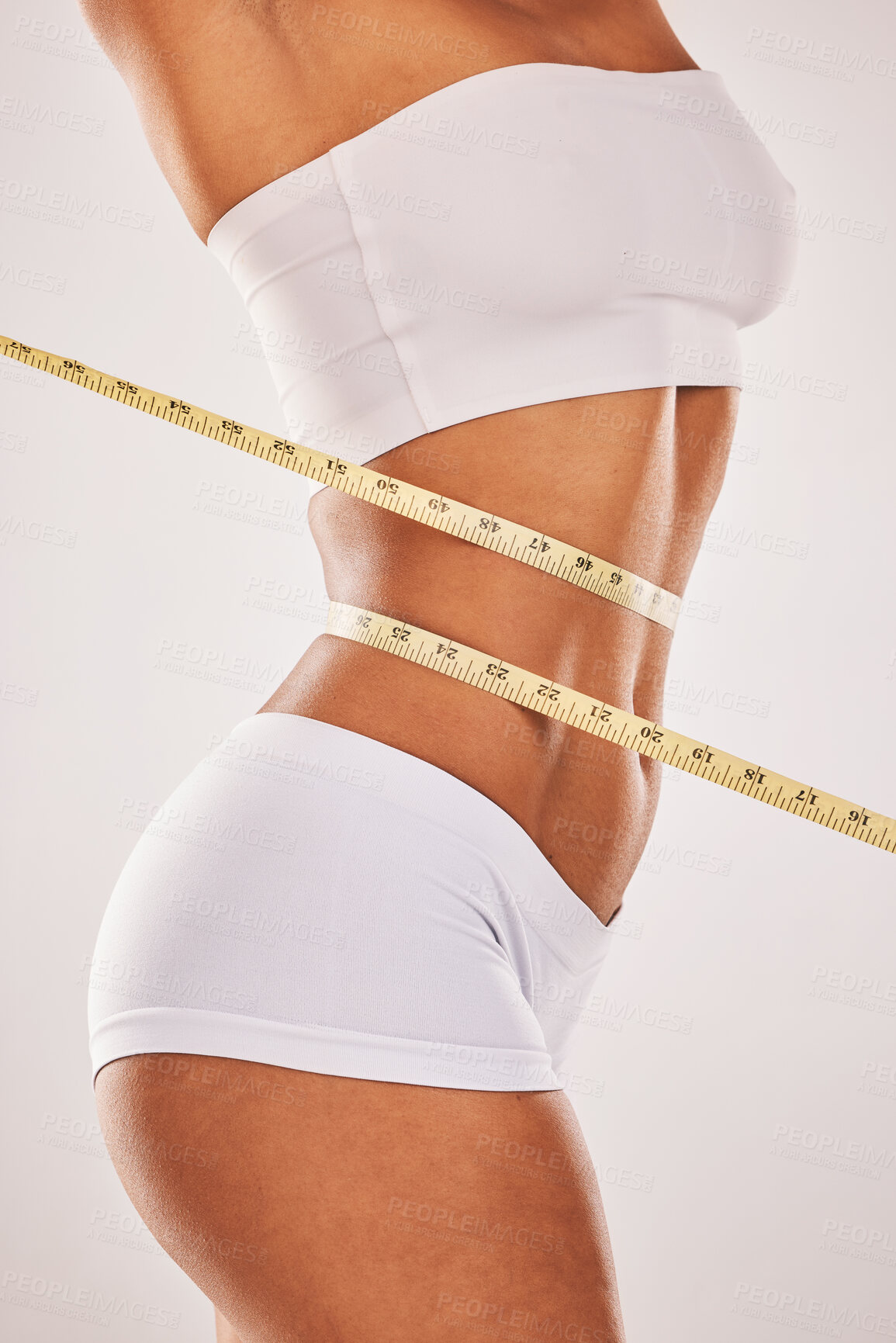 Buy stock photo Lose weight, body and woman with tape measure on stomach for diet, health and wellness. Healthy model studio background for fitness, goal and motivation in underwear for exercise results and progress