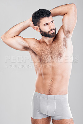 Buy stock photo Fitness, body and a man underwear model in studio on a gray background for health or grooming. Aesthetic, muscle and manly with a handsome young male posing to promote wellness or lifestyle