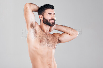 Buy stock photo Fitness, muscles and sexy man in a studio after a bodybuilding workout or sport training. Health, wellness and muscular male model flexing his biceps while posing isolated by a gray background.