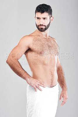 Buy stock photo Body, man and skincare with towel, cosmetics and dermatology with hygiene, clean and guy on grey studio background. Male, thinking and hairy gentleman with idea, aesthetics and wellness on backdrop