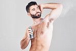 Deodorant, beauty spray and man in studio for hygiene, fresh scent or sweat control. Male model spraying armpit for body odor, smell and cleaning cosmetics, shower product and skincare on background