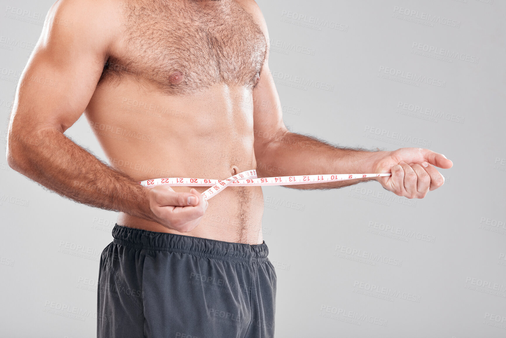 Buy stock photo Health, fitness and man with measuring tape on waist, healthy diet and exercise for body care. Sports, nutrition and stomach, tracking weight loss and six pack progress isolated on grey background.