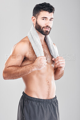 Buy stock photo Health, fitness and body portrait of man with towel on neck, sports workout and hygiene isolated on grey background. Sweat, confidence and male model smile, self care mindset for exercise in studio.