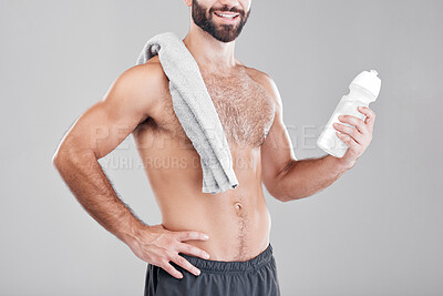 Buy stock photo Fitness, exercise and man with water bottle, towel and workout for wellness, healthy lifestyle and grey studio background. Male, athlete or liquid for after training, practice or endurance for energy