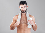Portrait, man and skincare for water bottle, towel and hygiene after training, shower and guy on grey studio background. Mockup, male and gentleman with cosmetics, confident and grooming for wellness