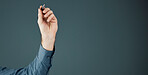 Business, mockup and hand with pen, space and ideas for opportunity, logo and brand development on dark studio background. Arm, corporate and man make notes, space and product placement on backdrop