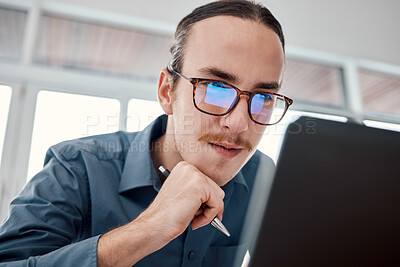 Buy stock photo Serious man, internet and laptop in office for email, typing and creative, design and idea in business. Website, search and seo guy with glasses busy on online project, task and problem solving in IT
