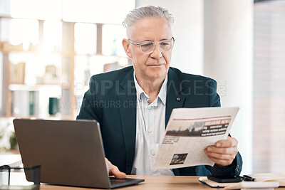 Buy stock photo Business, senior man or manager with newspaper, laptop or focus for information, modern office or planning. Corporate, male leader or entrepreneur with document, reading or concentration in workplace