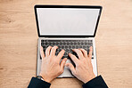 Hands, laptop and typing with green screen above on mockup display for communication, advertising or marketing. Hand of person working on computer for email, advertisement or branding on wooden table