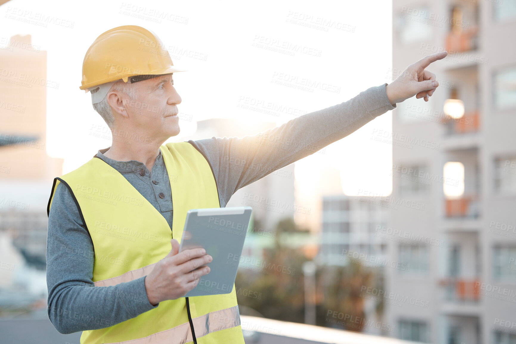 Buy stock photo Digital tablet, city and male construction worker working on building for maintenance, renovation or repairs. Leadership, contractor and senior man industry worker at a town site with a mobile device