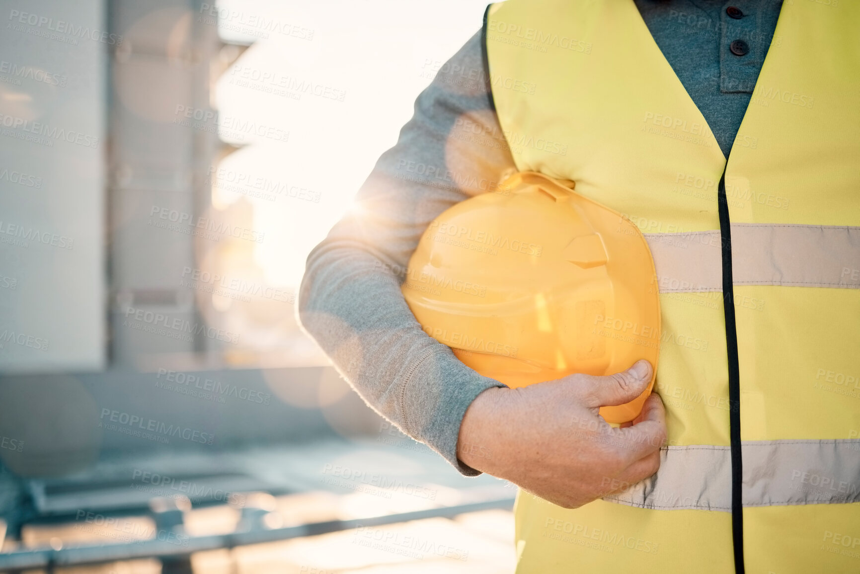 Buy stock photo Engineering, helmet and hands of construction worker in lens flare for urban development and architecture mission. Building contractor, builder person or technician with safety gear on city rooftop