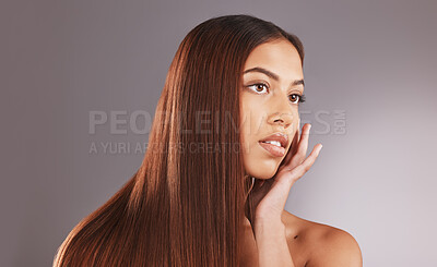Buy stock photo Woman, long hair and face for skincare, facial or beauty cosmetics against a gray studio background. Attractive female touching skin in self love or haircare for cosmetic keratin treatment on mockup