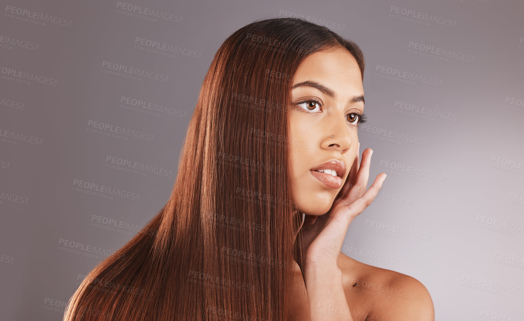 Buy stock photo Woman, long hair and face for skincare, facial or beauty cosmetics against a gray studio background. Attractive female touching skin in self love or haircare for cosmetic keratin treatment on mockup
