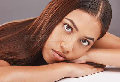 Buy stock photo Portrait, skincare and hair with a model black woman in studio on a gray background for keratin treatment. Face, beauty or haircare with an attractive young female indoor to promote a natural product