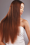 Black woman with straight brown hair isolated on studio background for healthy glow, beauty shine or care. Young  USA model or person for natural growth, red dye color and salon hairdresser treatment