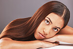 Portrait, beauty and hair with a model black woman in studio on a gray background for keratin treatment. Face, natural or haircare with an attractive young female indoor to promote a grooming product