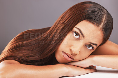 Buy stock photo Portrait, beauty and hair with a model black woman in studio on a gray background for keratin treatment. Face, natural or haircare with an attractive young female indoor to promote a grooming product