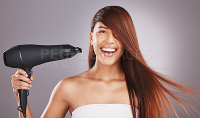 Buy stock photo Hair, hairdryer and portrait of woman salon smile, happy and excited isolated against studio gray background. Hairstyle, model and natural beauty female with self care, haircare and drying or styling