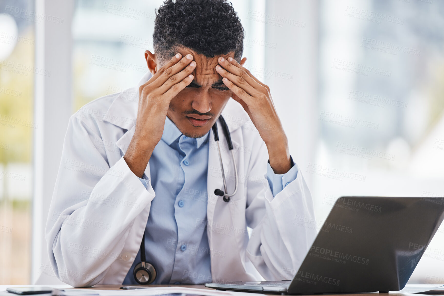 Buy stock photo Burnout, stress or man doctor on laptop with headache from depression, mental health or anxiety medical review. Tired, mental health or sad nurse frustrated, angry or depressed from medicine report