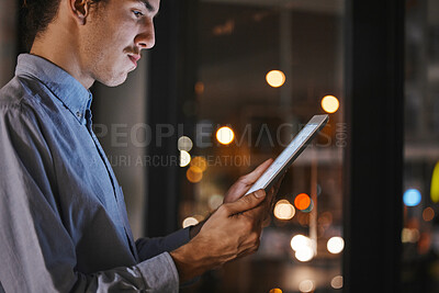 Buy stock photo Businessman, night and office with tablet in hands for research, market analysis and communication at job. Man, mobile touchscreen ux and reading for data analytics, progress and growth of company