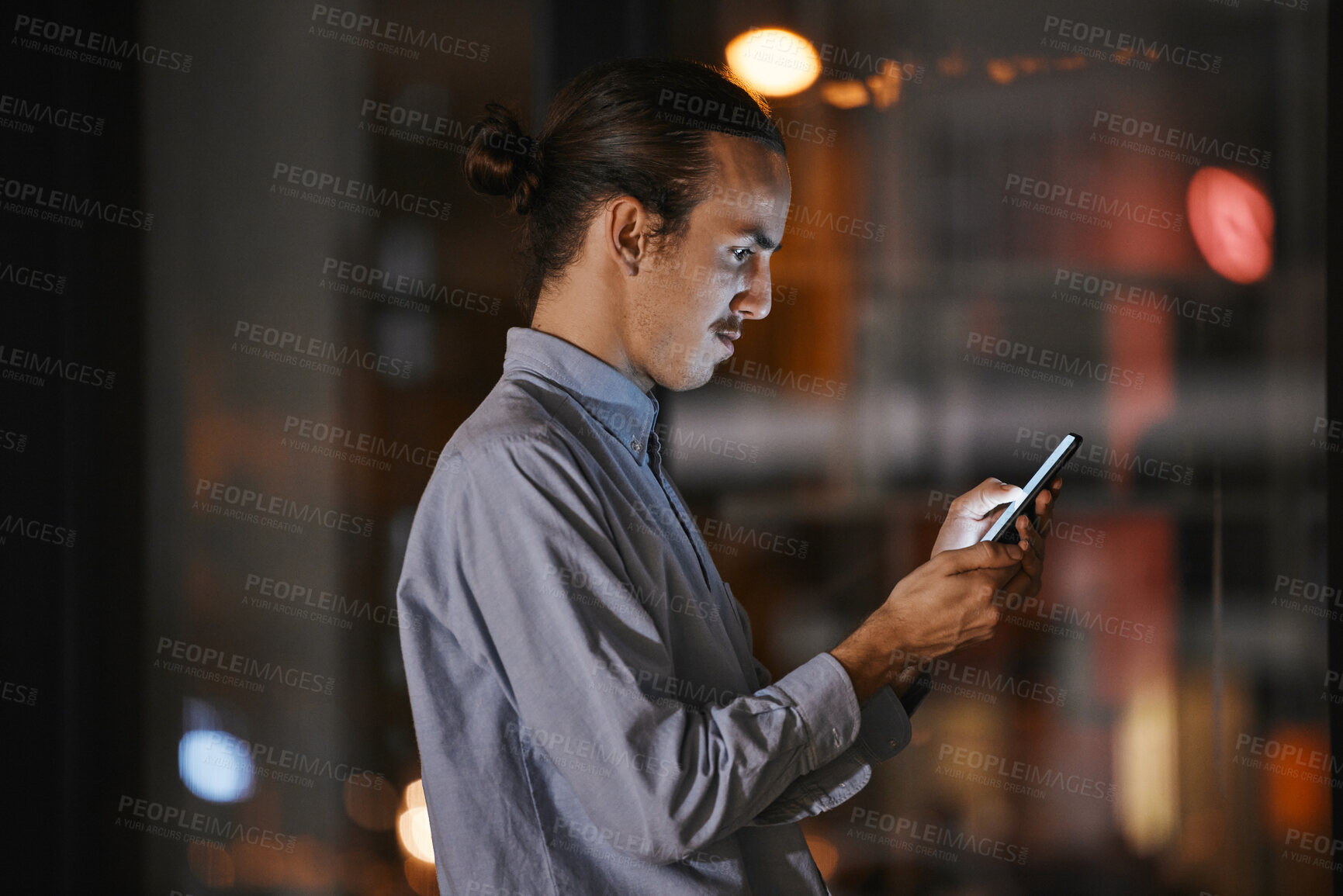 Buy stock photo Phone, night and communication with a business man in his office, working late to make a global deadline. Mobile, contact and networking with a male employee at work using a smartphone app to email