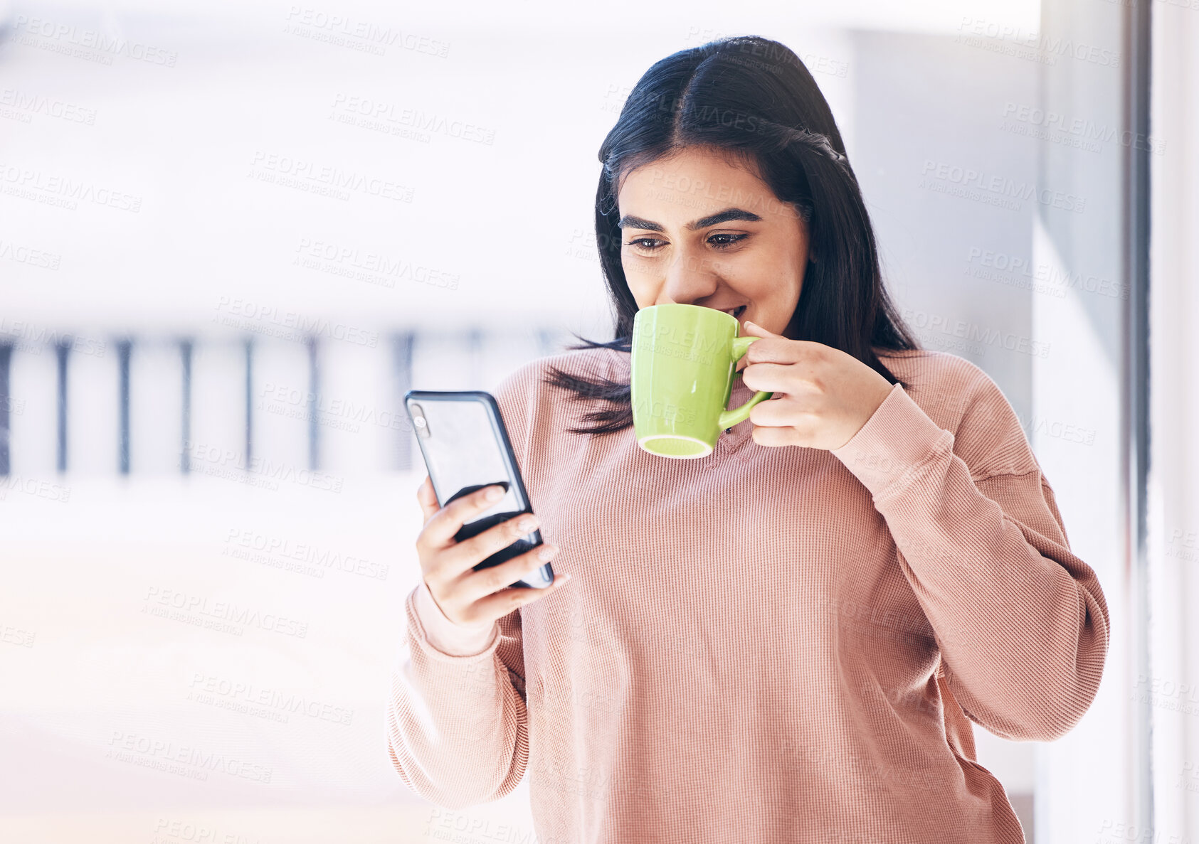 Buy stock photo Student, phone or drinking coffee in house, home or penthouse apartment on social media app, internet or dating website. Happy smile, woman and relax tea cup, mobile blog or communication with mockup