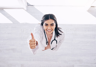 Buy stock photo Top view, portrait or doctor thumbs up for success, vote or clinic approval for hospital life insurance or winner trust on mock up. Smile, happy or yes hands for healthcare worker woman in wellness
