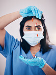 Woman, doctor and hands with face mask and pills for healthcare or antibiotics against a studio background. Female medical nurse expert with latex gloves, tablets or prescription medication for pain