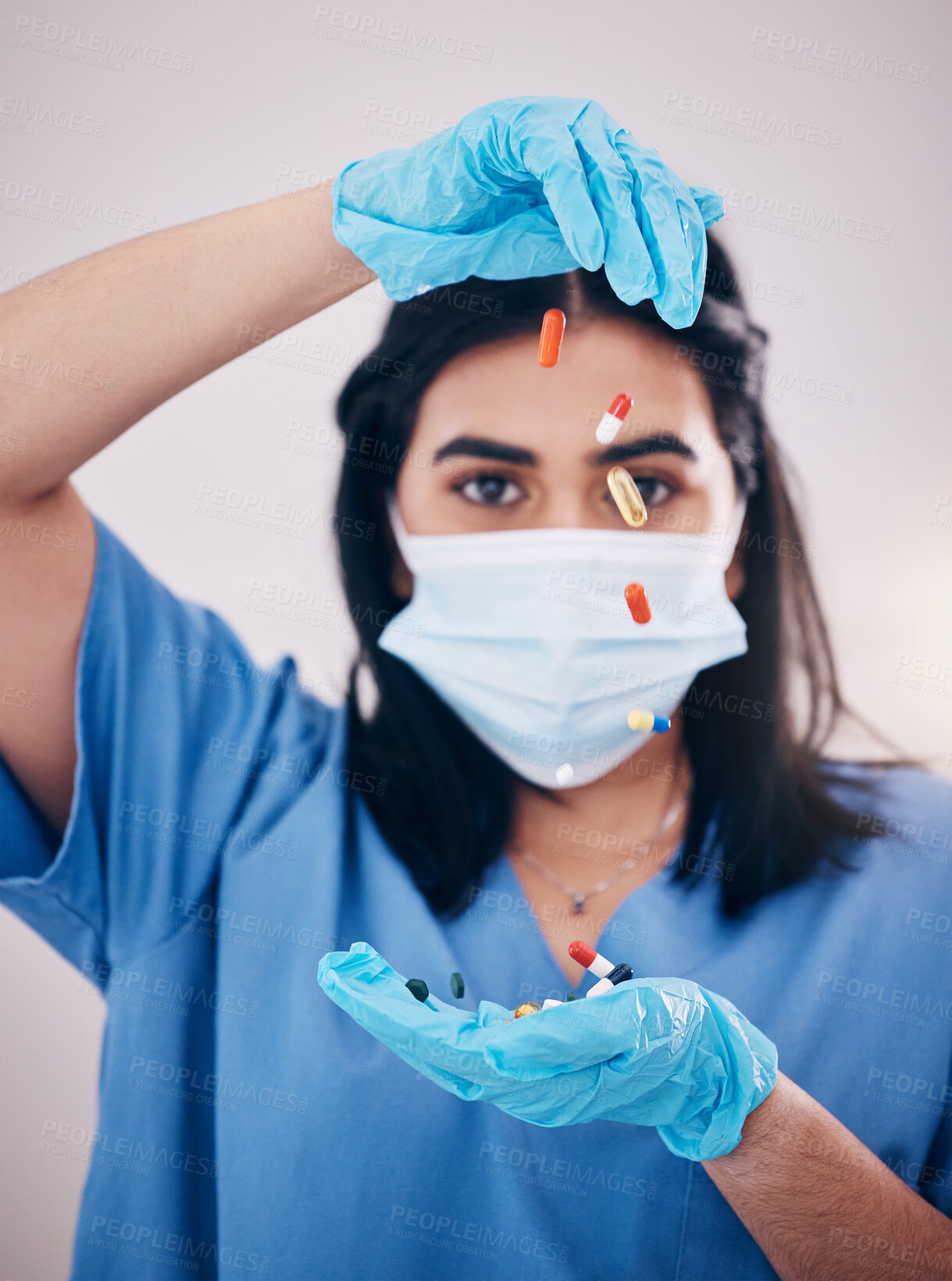 Buy stock photo Woman, doctor and hands with face mask and pills for healthcare or antibiotics against a studio background. Female medical nurse expert with latex gloves, tablets or prescription medication for pain