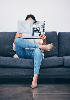 Buy stock photo Relax, magazine or girl reading newspaper articles on sofa at home for information or story updates. Press, focus or woman relaxing and studying abstract art for knowledge in a publication on couch