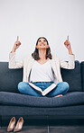 Reading, book and woman on sofa pointing for mockup, empty and blank copy space in living room. Advertising, marketing and girl on couch with story, literature and textbook for knowledge or research