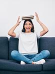 Student or woman with books balance on head for study, education or university time management and reading. Knowledge, learning and young college person on sofa with history, philosophy or literature