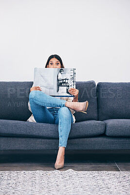 Buy stock photo Wow, magazine or woman reading newspaper articles for trendy information on house sofa with wall mockup. Story, surprised or shocked person studying abstract art for knowledge or press announcement 