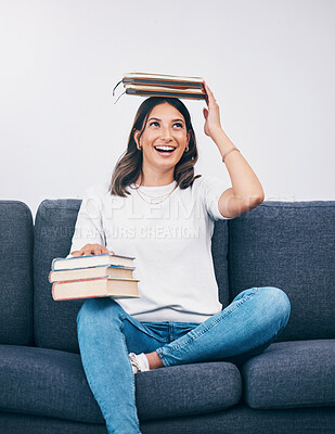 Buy stock photo Happy student or woman with books balance on head of study, education or university time management and reading. Knowledge, learning and college person on sofa with history, philosophy or scholarship