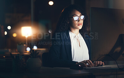 Buy stock photo Serious, night and business black woman on computer for planning, project management and research. Dark office, overtime and female worker focus working on strategy, reading website and typing email