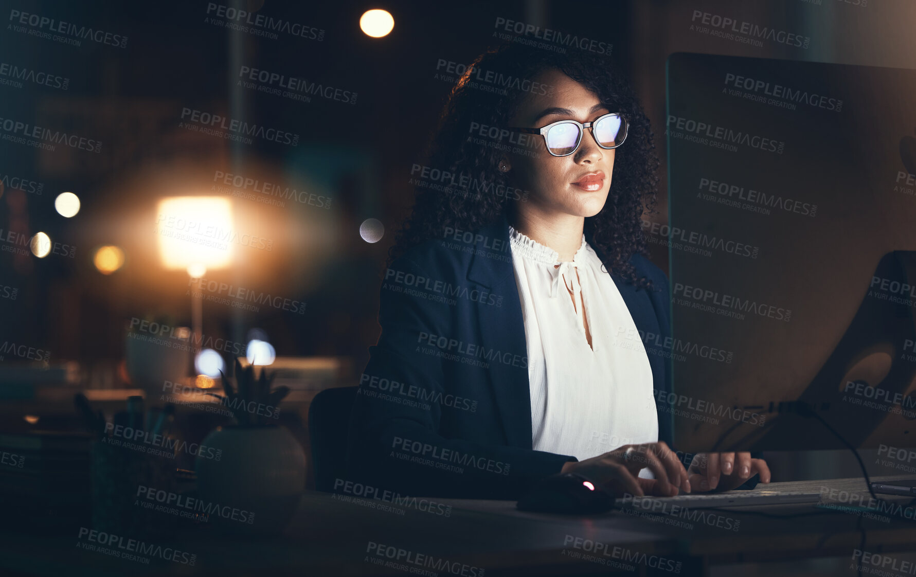 Buy stock photo Serious, night and business black woman on computer for planning, project management and research. Dark office, overtime and female worker focus working on strategy, reading website and typing email